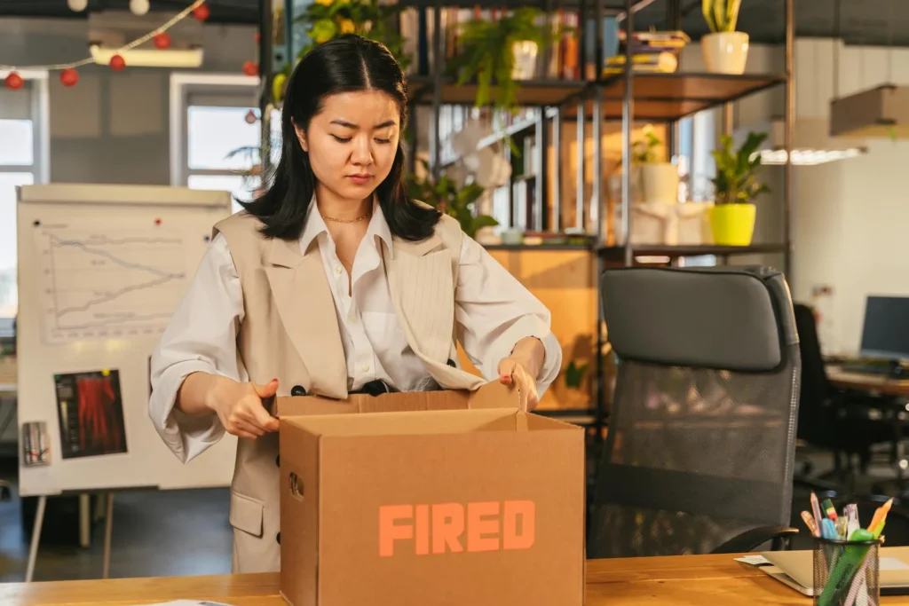 Expat holding a termination letter in a German office