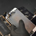 Technician repairing a smartphone under the EU right to repair in Germany.